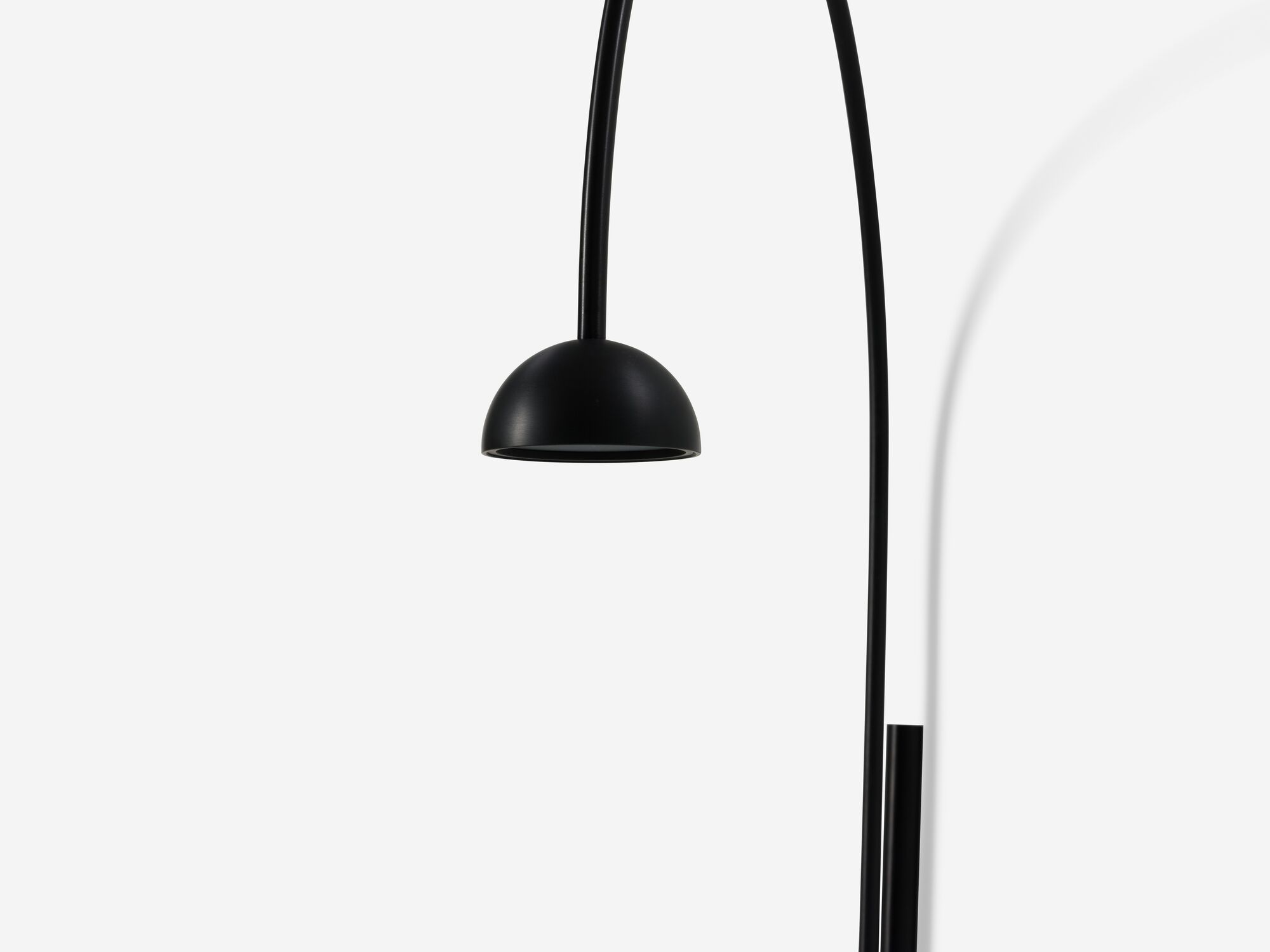 Detail view of black arched wall lamp